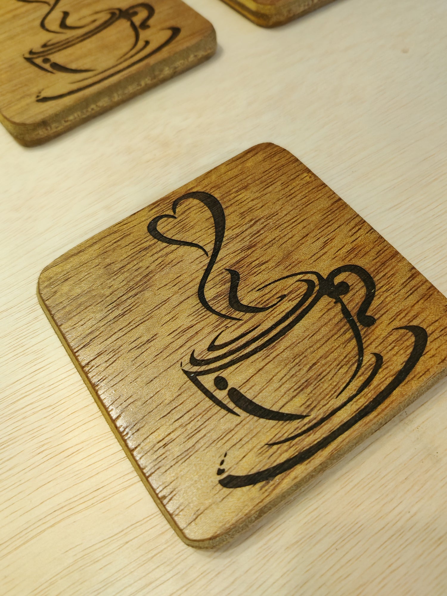 wooden coasters , laser engraved with one heart