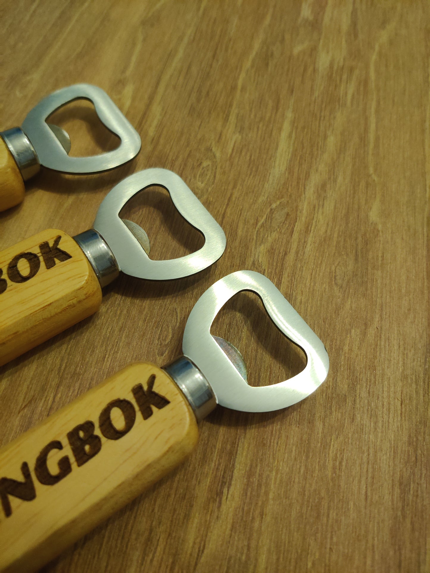 classic bottle opener with springbok logo , wooden handle and stainless steel opener and magnet