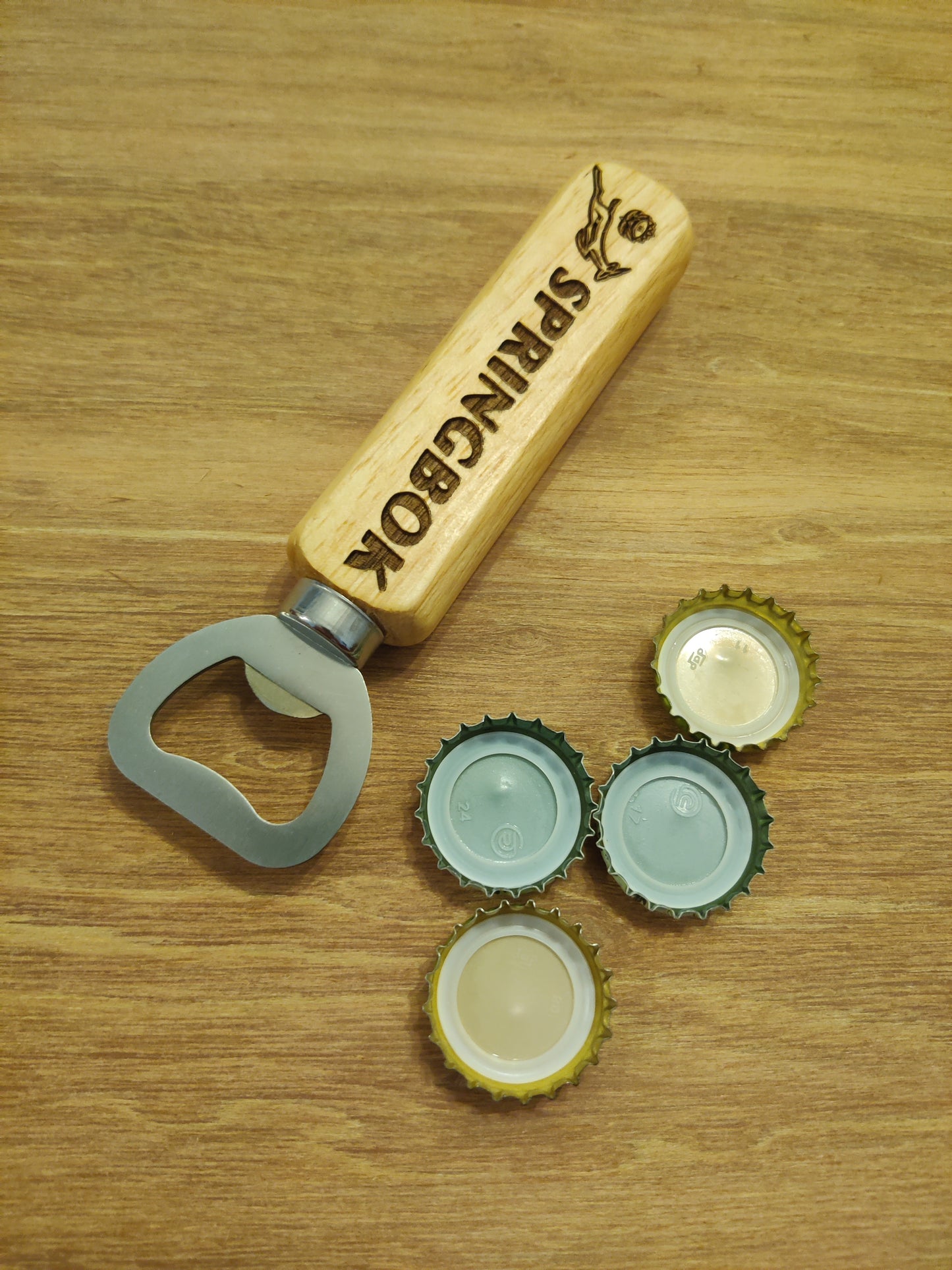 Springbok logo bottle opener with wooden handle , and magnet in handle for metal surface