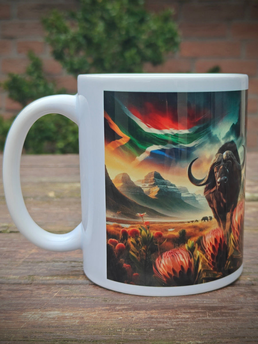 Mug with Buffalo and Proteas , featuring a landscape with the Drakensberg mountains and the South African flag - dieWatergat.nl