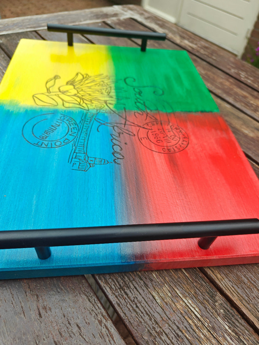 Nostalgic South Africa serving tray with sturdy metal handles.