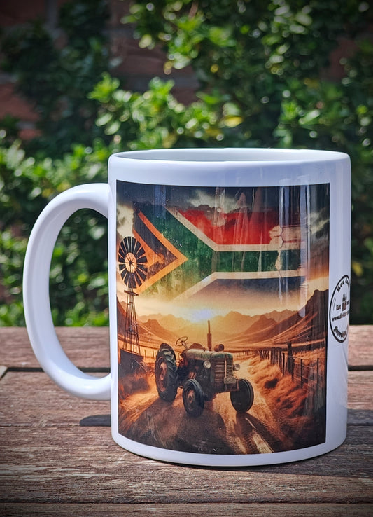 Proudly South African Tractor Mug – Rustic Green Tractor, Flag in Sky, Windmill, Fence & Mountain Scene